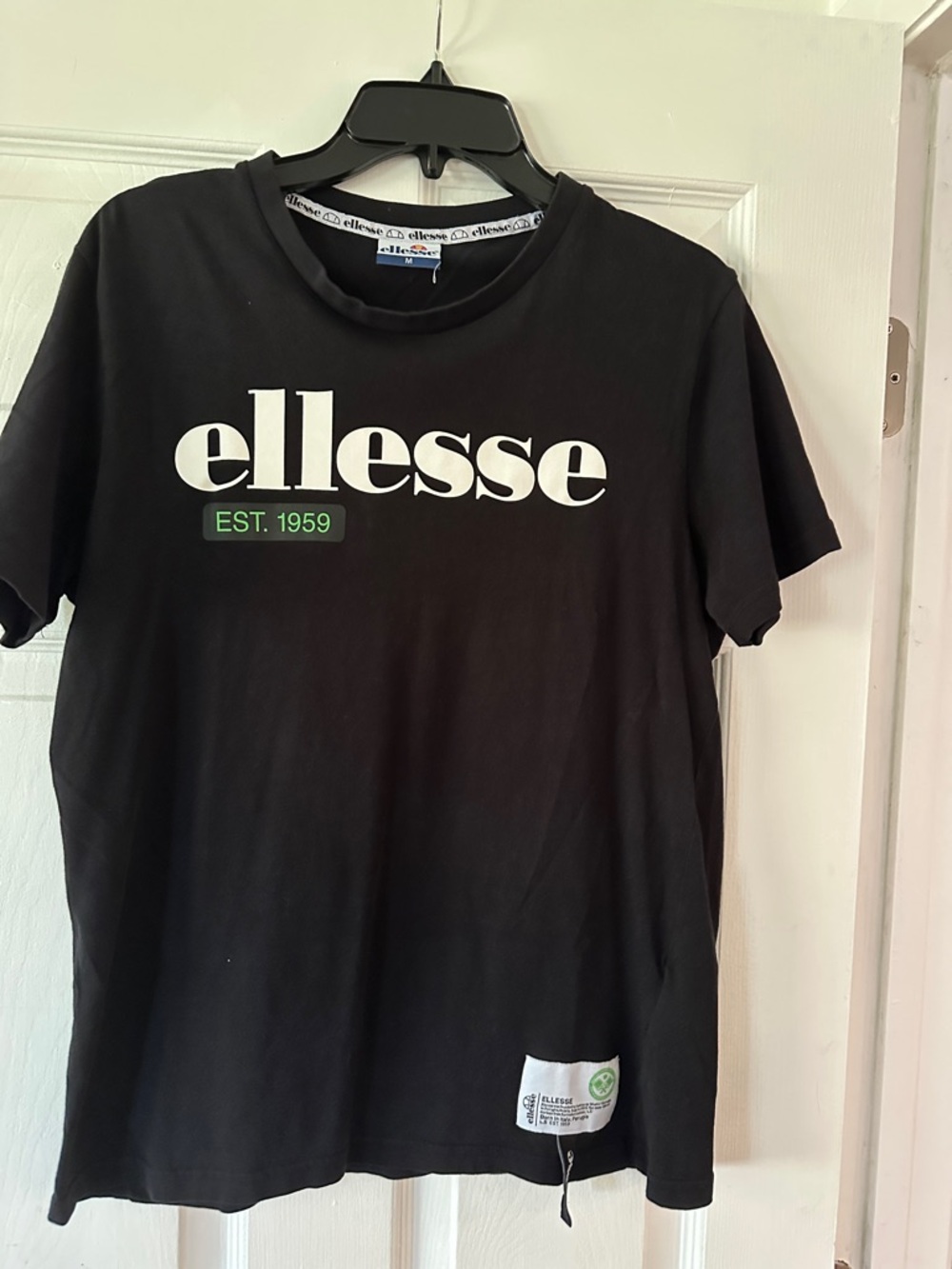 Ellesse Black Tee with White Logo and Green Accent